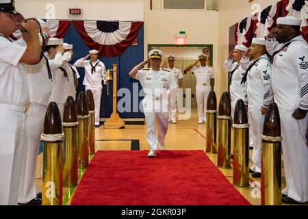 AGANA HEIGHTS, Guam (June 16, 2021) - Rear Adm. Benjamin Nicholson is piped aboard during a change of command ceremony at Guam High School. Nicholson relieved Rear Adm. John Menoni as commander, Joint Region Marianas. Stock Photo