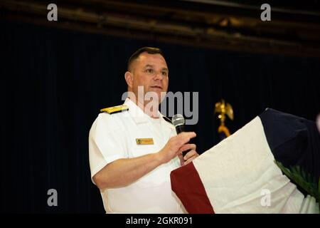 AGANA HEIGHTS, Guam (June 16, 2021) - Rear Adm. Benjamin Nicholson commander, Joint Region Marianas (JRM), offers remarks during the JRM change of command ceremony at Guam High School. Nicholson relieved Rear Adm. John Menoni as JRM commander. Stock Photo