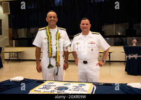 AGANA HEIGHTS, Guam (June 16, 2021) - Rear Adm. John Menoni and Rear Adm. Benjamin Nicholson, commander, Joint Region Marianas (JRM) pose for a photo following the JRM change of command ceremony at Guam High School. Stock Photo
