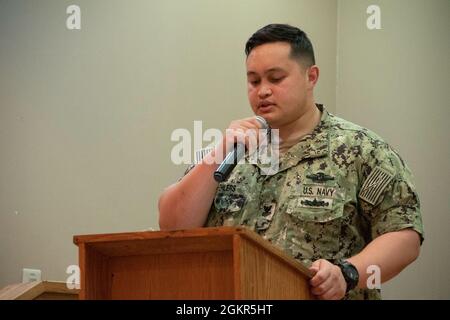 U.S. Navy Hospital Corpsman 1st Class Frederick Ehlers, preventive medicine technician assigned to Combined Arms Training Center Camp Fuji, Health Annex, reads the 2021 Hospital Corpsman 123rd Birthday message during a ceremony, June 17, Combined Arms Training Center Camp Fuji, Japan. Stock Photo