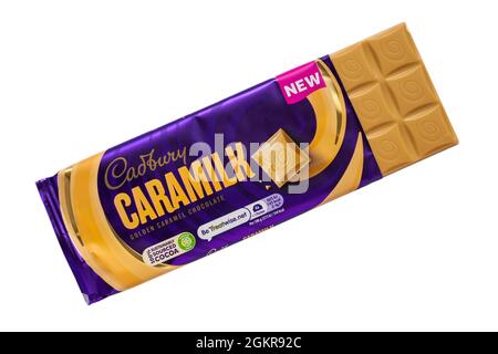 Bar of Cadbury Caramilk chocolate bar opened to show contents isolated on white background - golden caramel chocolate Stock Photo