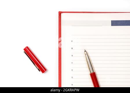 Open clean red notebook with red pen. Notebook, Education, school, college. Gaining knowledge, planning. View from above. Copy space Stock Photo
