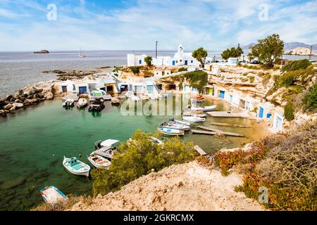 View over fishing harbour with boats and colourful boat houses, Mandrakia, Milos, Cyclades, Aegean Sea, Greek Islands, Greece, Europe Stock Photo