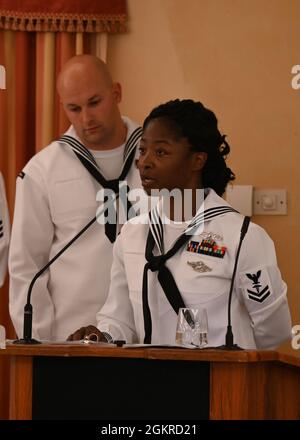 210619-N-GK686-1223 SANT’ALESSIO SICULO, Italy (June 19, 2021) Hospital Corpsman 2nd Class Brenda Codrington, assigned to U.S. Navy Medicine Readiness and Training Command (NMRTC) Sigonella, recites a hospital corpsman poem during the 123rd Hospital Corps Birthday Ball hosted by U.S. Navy Medicine Readiness and Training Command (NMRTC) Sigonella at the Capo Dei Greci Taormina Coast- Resort Hotel & Spa, June 19, 2021. NMRTC Sigonella is a community hospital located in the heart of the Mediterranean in Sicily, Italy. It’s comprised of a local stellite clinic and two branch health clinics located Stock Photo