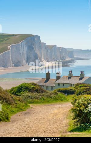 View of Seven Sisters Chalk Cliffs and Coastguard Cottages at Cuckmere Haven, South Downs National Park, East Sussex, England, United Kingdom, Europe Stock Photo