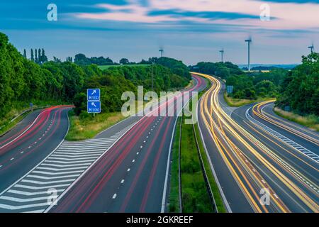 View of trail lights on the intersection of M1 and M18 Motorways at dusk in South Yorkshire, Sheffield, England, United Kingdom, Europe Stock Photo