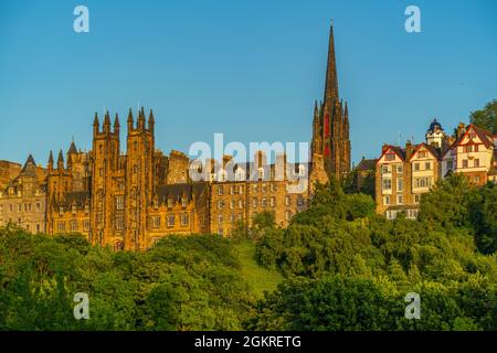 View of New College, The University of Edinburgh, on The Mound, from Princes Street at sunset, Edinburgh, Scotland, United Kingdom, Europe Stock Photo