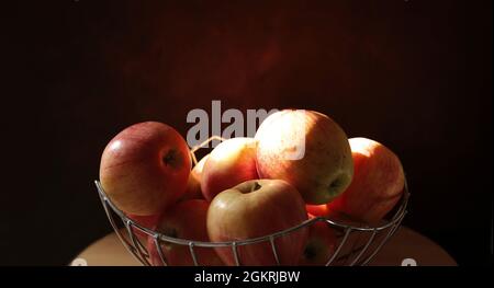 Group of delicious red apples on black background. Close-up. Stock Photo