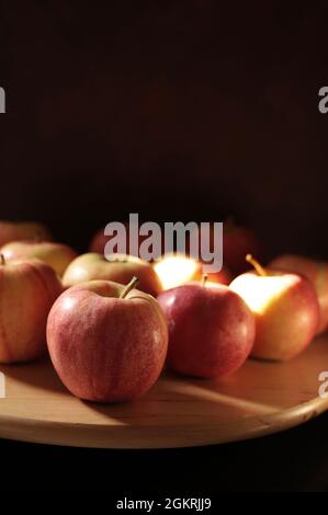 Group of delicious red apples on black background. Close-up. Stock Photo