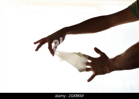 Removing latex gloves from hands.Once gloves have been removed make sure to wash your hands with soap and water. Stock Photo