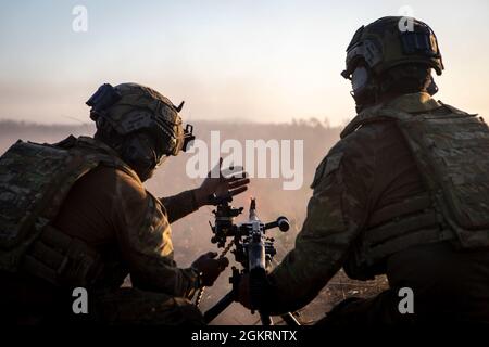 Australian Army soldiers fire an Australian MAG 58 general support ...