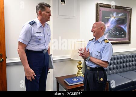 Vice Chief of Space Operations Gen. David Thompson, left, speaks with Lt. Gen. Luca Goretti, vice air chief of the Italian air force, before a meeting at the Pentagon, Arlington, Va., June 23, 2021. Thompson and Goretti discussed bilateral space cooperation between their military services. Stock Photo
