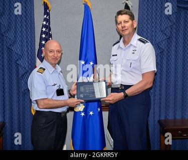 Lt. Gen. Luca Goretti, left, vice air chief of the Italian air force, poses with Vice Chief of Space Operations Gen. David Thompson after a meeting at the Pentagon, Arlington, Va., June 23, 2021. Goretti and Thompson discussed bilateral space cooperation between their military services. This image has been altered to obscure security badges. Stock Photo
