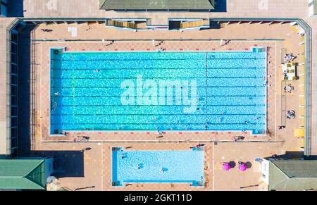 An aerial view of an outdoor Lido swimming pool in Summer sunshine Stock Photo