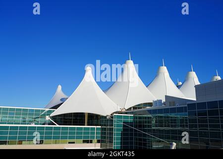 DENVER, CO -10 APR 2021- Exterior view of the Jeppesen Terminal with white tent roof at Denver International Airport, or DIA (DEN) located at the foot Stock Photo