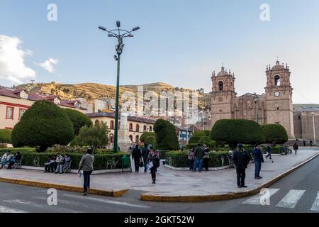 PUNO, PERU - MAY 13, 2015: People on Plaza de Armas square in Puno, Peru Stock Photo