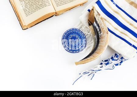 Yom kippur, Rosh hashanah, jewish New Year holiday, concept. Religion image of shofar - horn on white prayer talit. Stock Photo