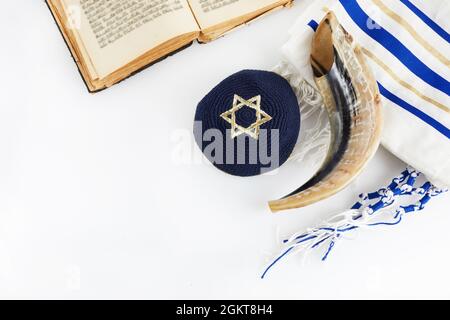 Yom kippur, Rosh hashanah, jewish New Year holiday, concept. Religion image of shofar - horn on white prayer talit. Stock Photo