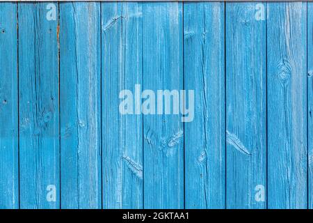 Light blue painted wooden planks background. Vertical strips of wood. Wood knots. Stock Photo