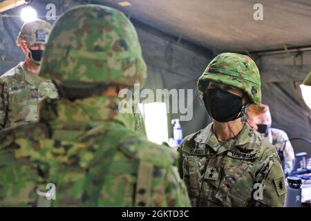 Maj. Gen. Laura Yeager, 40th Infantry Division commander conducted battlefield circulation to Yausubetsu Training Area and visited the first U.S. Army and 陸上自衛隊 Japan Ground Self-Defense Force bilateral Fire Direction Center June 28.  The bilateral FDC was critical in synchronizing fire missions between the 17th Field Artillery Brigade and 4th Field Artillery Group, JGSDF Northern Army during the High Mobility Artillery Rocket System and Multiple Launch Rocket System Live Fire Exercise.  Before leaving, Yeager presented the 40th ID commanders coin of excellence to Soldiers from 2nd Platoon, A Stock Photo