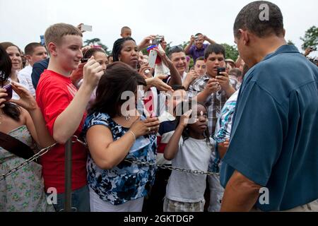 July 4, 2011'I'm always trying to capture how people react to the President especially when he works a rope line. On the Fourth of July, the President was greeting members of the military and their families on the South Lawn when a young girl struck a salute as the President approached.' (Official White House Photo by Pete Souza)  This official White House photograph is being made available only for publication by news organizations and/or for personal use printing by the subject(s) of the photograph. The photograph may not be manipulated in any way and may not be used in commercial or politic Stock Photo