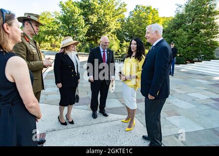 (From left to right): Jane Freedom; Maj. Gen. Andrew Freeman, head of Australian defense staff, Embassy of Australia; Elizabeth Sinodinos; Australia’s Ambassador to the U.S. Arthur Sinodinos AO; Karen Durham-Aguilera, executive director, Army National Military Cemeteries; and Charles R. Alexander, Jr., superintendent, Arlington National Cemetery talk outside the Memorial Amphitheater at Arlington National Cemetery, Arlington, Virginia, June 29, 2021. Stock Photo