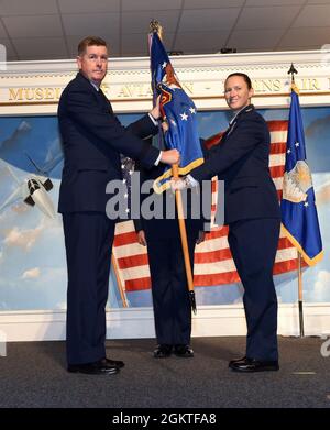 Lt. Gen. Gene Kirkland, Air Force Sustainment Center commander, passes the 78th Air Base Wing guidon to Col. Lindsay Droz, 78th Air Base Wing commander, at the Museum of Aviation at Robins Air Force Base, Georgia, June 29, 2021. As the new 78th ABW commander, Droz becomes responsible for the logistics, medical, civil engineer, security and mission support functions at Robins. Stock Photo