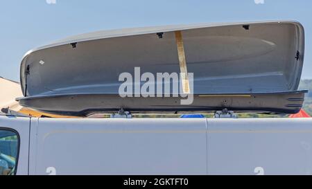 Side Opening Roof Box at Top of White Van Stock Photo