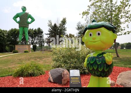 Little Green Sprout with Jolly Green Giant statue in the background.Green Giant Statue Park.Blue Earth.Blue Earth.USA Stock Photo