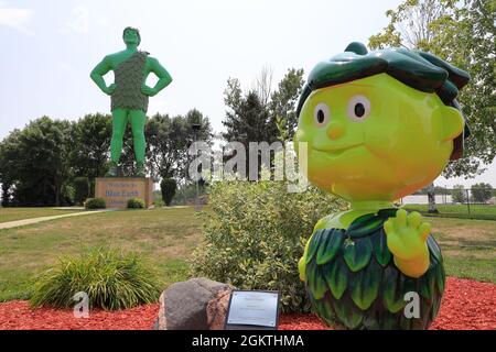 Little Green Sprout with Jolly Green Giant statue in the background.Green Giant Statue Park.Blue Earth.Blue Earth.USA Stock Photo