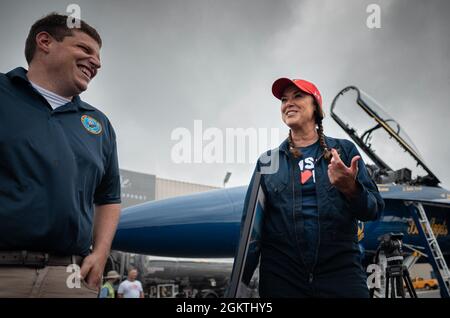 210630-N-JH293-1329  GARDNER, Kan. (June 30, 2021) Dr. Michelle Hubbard, superintendent of the Shawnee Mission School District, speaks with Operations Specialist 2nd Class Mark Ogan, a recruiter assigned to Navy Talent Acquisition Group Mid America, at New Century Air Center, June 30, 2021. Hubbard was selected as the key influencer to fly with Lt. Julius Bratton, a pilot and narrator assigned to the U.S. Navy flight demonstration squadron, the Blue Angels. The Blue Angels will be performing at the Kansas City Air Show July 3-4 and takes place during Kansas City Navy Week, the first in-person Stock Photo
