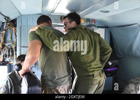 210630-N-VP310-0796  ODESA, Ukraine (June 30, 2021) Egyptian, United Arab Emirates, Canadian and Turkish military officers ride a Ukrainian Mi-8 Helicopter after an air demonstration for Exercise Sea Breeze 2021 Odesa, Ukraine, June 30, 2021. Exercise Sea Breeze is a multinational maritime exercise cohosted by the U.S. Sixth Fleet and the Ukrainian Navy since 1997. Sea Breeze 2021 is designed to enhance interoperability of participating nations and strengthens maritime security and peace in the region. Stock Photo