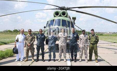 210630-N-VP310-0830  ODESA, Ukraine (June 30, 2021) Canadian, Ukrainian, Turkish, Egyptian and United Arab Emirate Officers pose for a photo after attending an Ukrainian air demonstration for Exercise Sea Breeze 2021 Odesa, Ukraine, June 30, 2021. Exercise Sea Breeze is a multinational maritime exercise cohosted by the U.S. Sixth Fleet and the Ukrainian Navy since 1997. Sea Breeze 2021 is designed to enhance interoperability of participating nations and strengthens maritime security and peace in the region. Stock Photo