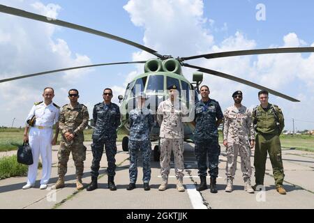 210630-N-VP310-0831  ODESA, Ukraine (June 30, 2021) Canadian, Ukrainian, Turkish, Egyptian and United Arab Emirate Officers pose for a photo after attending an Ukrainian air demonstration for Exercise Sea Breeze 2021 Odesa, Ukraine, June 30, 2021. Exercise Sea Breeze is a multinational maritime exercise cohosted by the U.S. Sixth Fleet and the Ukrainian Navy since 1997. Sea Breeze 2021 is designed to enhance interoperability of participating nations and strengthens maritime security and peace in the region. Stock Photo