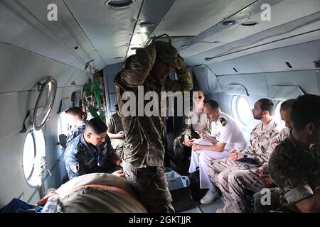 210630-N-VP310-0776  ODESA, Ukraine (June 30, 2021) Egyptian, United Arab Emirates, Canadian and Turkish military officers ride a Ukrainian Mi-8 Helicopter after an air demonstration for Exercise Sea Breeze 2021 Odesa, Ukraine, June 30, 2021. Exercise Sea Breeze is a multinational maritime exercise cohosted by the U.S. Sixth Fleet and the Ukrainian Navy since 1997. Sea Breeze 2021 is designed to enhance interoperability of participating nations and strengthens maritime security and peace in the region. Stock Photo