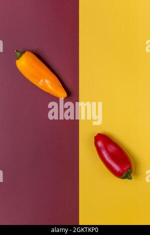composition with two peppers and colored lines from top view Stock Photo