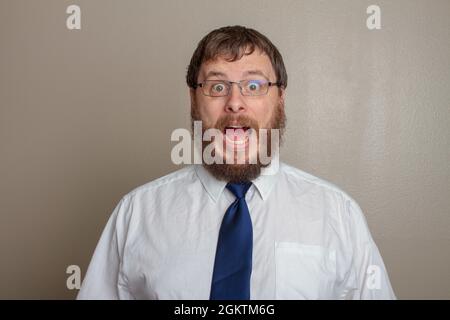 Businessman yelling at someone loudly Stock Photo