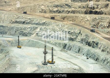 Blasthole drill in an open pit copper mine operation in Chile Stock Photo