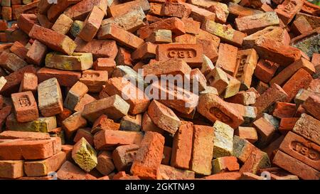 Pile of red bricks. Traditional Red Bricks Stack near a Construction Site in India. Rural India Stock Photo