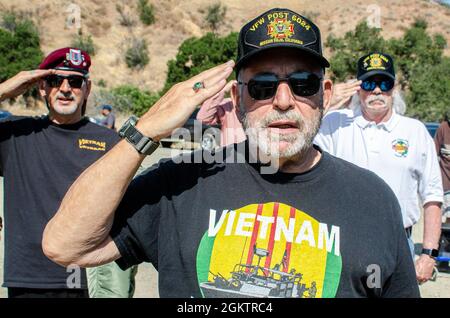 ANAHEIM HILLS, Calif. (July 1, 2021) - Vietnam War veterans salute at the playing of the National Anthem during a press conference organized by Orange County Supervisor Third District Don Wagner announcing the selection of 280-acre plot land, known as Gypsum Canyon, for establishing a local veterans cemetery with several civic leaders and veterans attending, including U.S. Navy Chief Mass Communication Specialist Elisandro T. Diaz, who is one of the founders and member of Orange County Veterans Memorial Park Foundation. OCVMP is credited for raising awareness of the need for a veterans cemeter Stock Photo