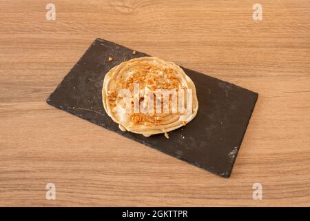 Mini sweet kinder cream pizza with waffles on black slate plate Stock Photo