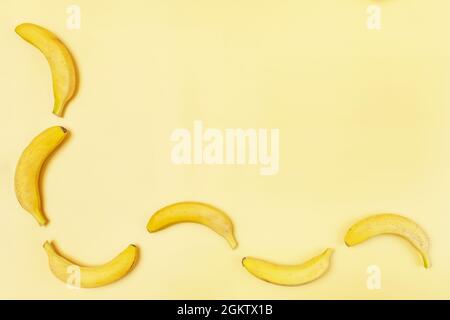 Ripe bananas on yellow background viewed from above Stock Photo
