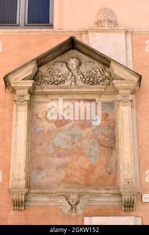 Italy, Rome, church of San Giovanni della Pigna, Madonnella called “Madonna col Bambino e Santi” with Saints Peter and Paul fresco of the 17th century Stock Photo