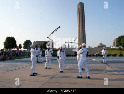 Sailors assigned to U.S. Navy Ceremonial Guard “Drill Team Platoon” perform at the National WWI Museum and Memorial during the Stars and Stripes Picnic in Kansas City, Missouri July 3, 2021. The event was part of Kansas City Navy Week, the first in-person Navy Week since the beginning of the COVID-19 pandemic, bringing Sailors from different Navy units across the U.S. to conduct focused outreach with members of the community. Navy Weeks consist of a series of events coordinated by the Navy Office of Community Outreach designed to give Americans an opportunity to learn about the Navy, its peopl Stock Photo