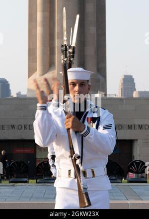 Seaman Roman Rangel, assigned to U.S. Navy Ceremonial Guard “Drill Team Platoon”, performs at the National WWI Museum and Memorial during the Stars and Stripes Picnic in Kansas City, Missouri July 3, 2021. The event was part of Kansas City Navy Week, the first in-person Navy Week since the beginning of the COVID-19 pandemic, bringing Sailors from different Navy units across the U.S. to conduct focused outreach with members of the community. Navy Weeks consist of a series of events coordinated by the Navy Office of Community Outreach designed to give Americans an opportunity to learn about the Stock Photo