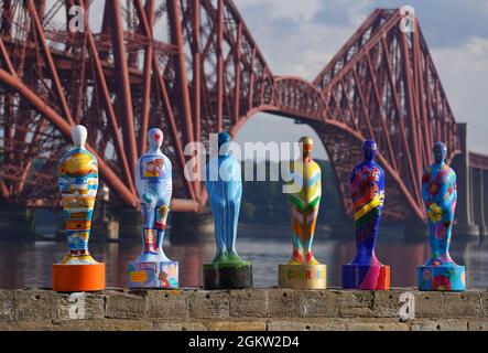 Some of the sculptures from the art installation Gratitude at The Forth Bridge at North Queensferry, ahead of going on display just outside of Edinburgh at Newhailes House and Gardens from Friday 17th September. The public art installation pays tribute to NHS staff and all key workers for their ongoing courage and dedication during the Covid-19 pandemic. Picture date: Wednesday September 15, 2021. Stock Photo