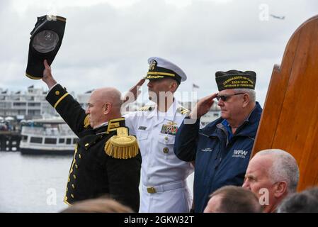 Cmdr. John Bends, commanding officer of USS Constitution, salutes during a wreath laying ceremony while underway in Boston, Massachusetts, on July, 4th, 2021. The USS Constitution got underway in commemoration of the 245th Independence Day. Stock Photo