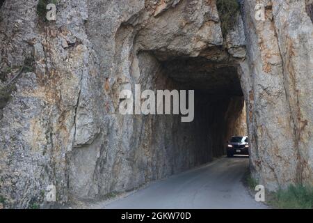 A car through Needles Eye Tunnel on Needles Highway in Custer State Park.Custer/Black Hills.South Dakota.USA Stock Photo