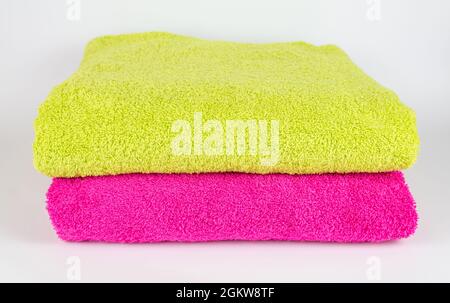 Light green and pink towel on white background Stock Photo