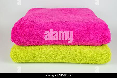 Pink and light green towel on white background Stock Photo